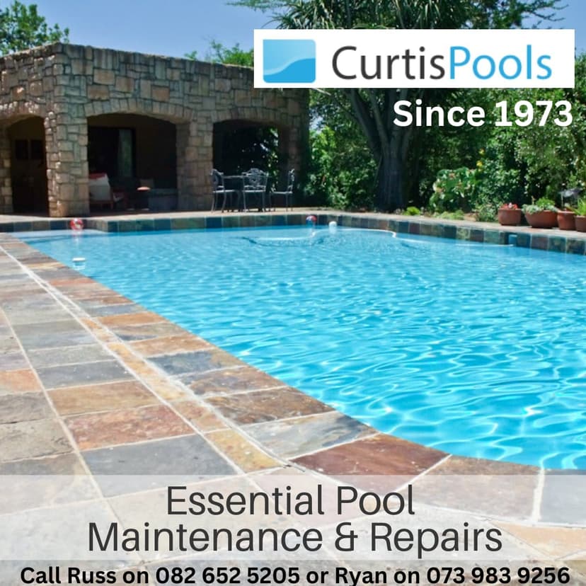 A large swimming pool surrounded by a stone patio