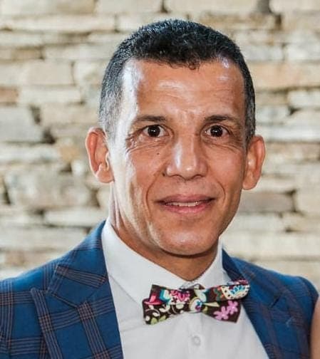 A man in a suit and bow tie