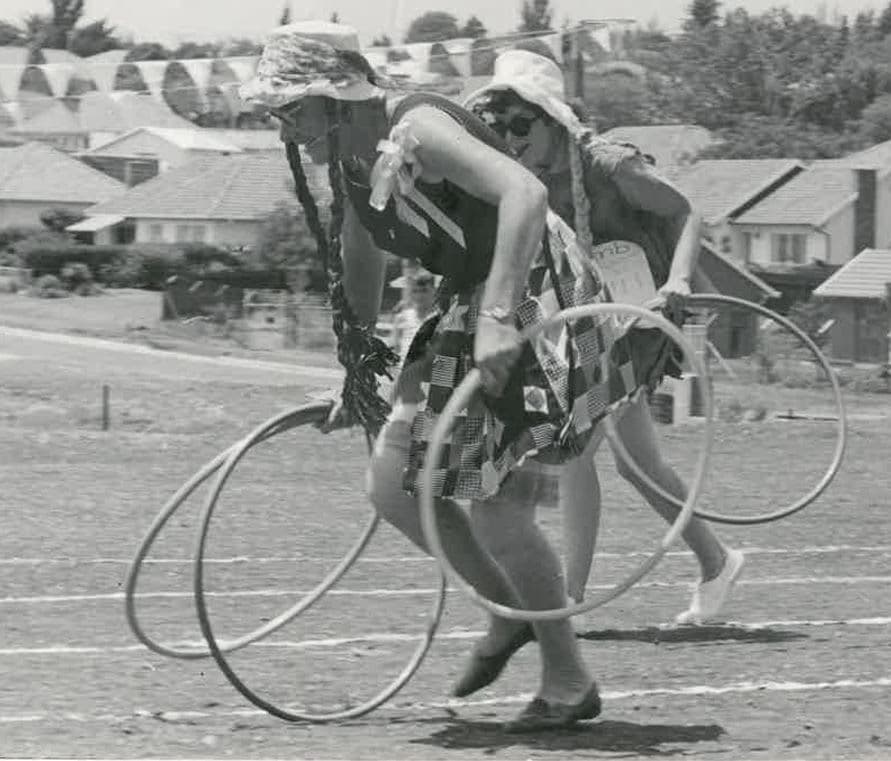 A couple of people that are holding some hoops